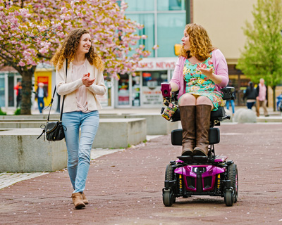 woman shopping on her ilevel power chair